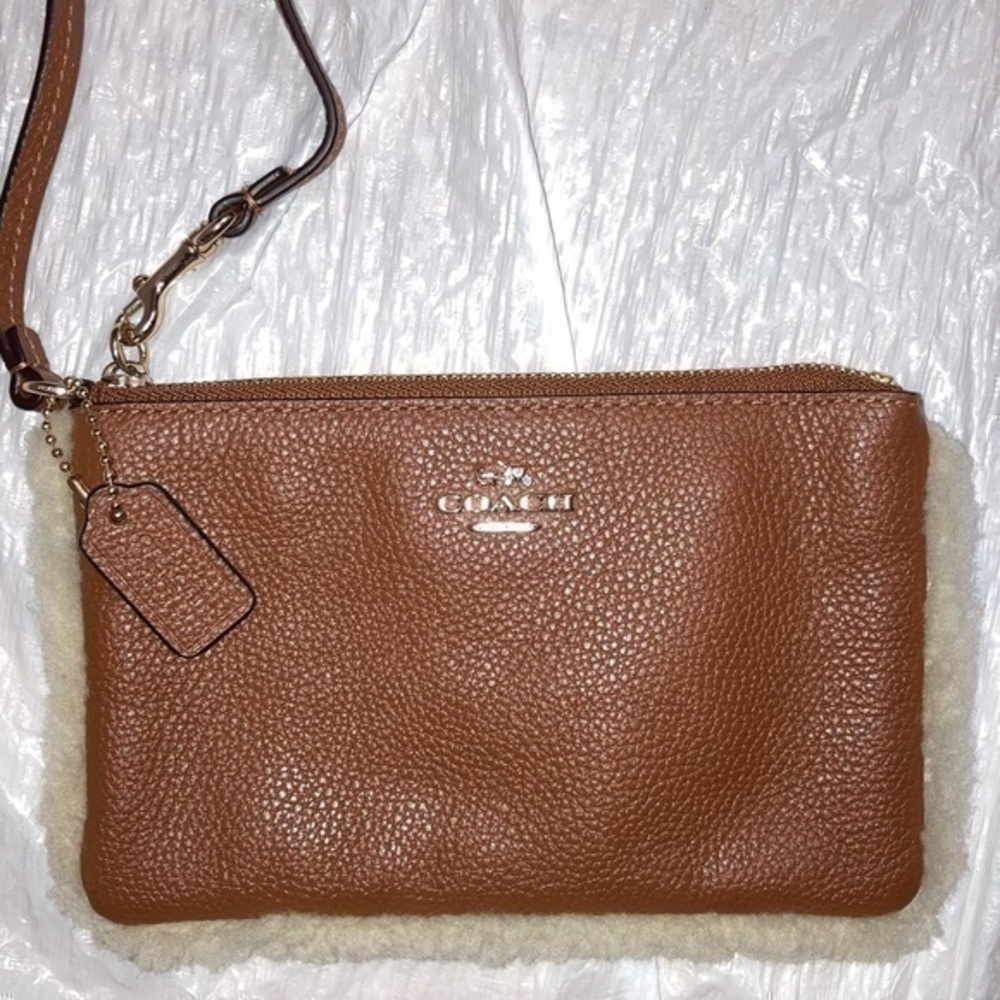 Coach brown pebbled leather shearling edge wristlet